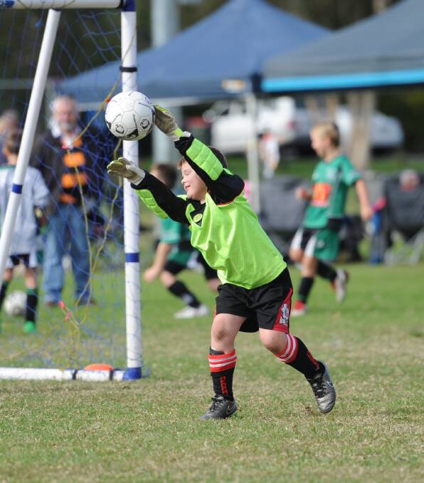 Great save Josh: Josh Neisler fends this shot away from his goal during the junior gala day on Sunday.