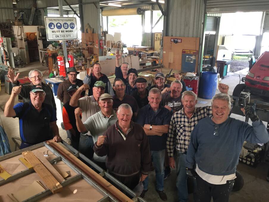 Having fun: Kendall Men's Shed co-ordinator John Haldare, right, and vice president Keith O’Connor second from right, along with fellow 'shedders' celebrating their collective effort.