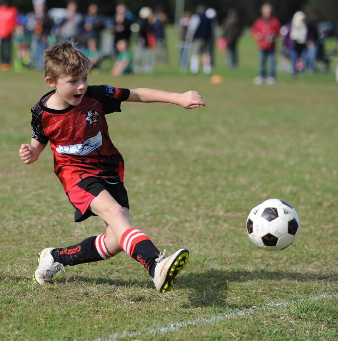 Go Lachlan: Redbacks junior soccer player Lachlan Campbell is perfectly balanced for this pass on Sunday.