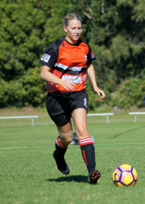 Solid game:  Lani Slade on the ball during the Camden Haven Redbacks ladies football team's game against South West Rocks on Saturday.