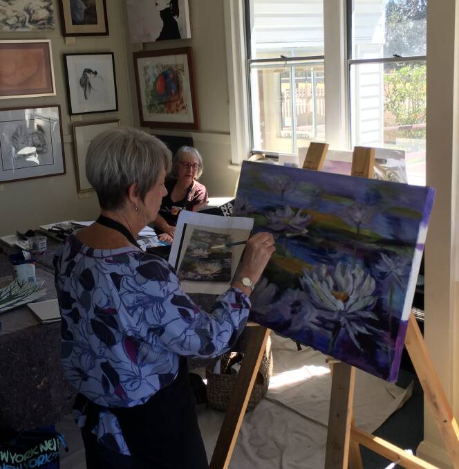 Fine art: Port Macquarie's Trish Cameron putting the finishing touches to her latest art piece during a regular Wednesday get together of the Hastings Valley Fine Art Association.