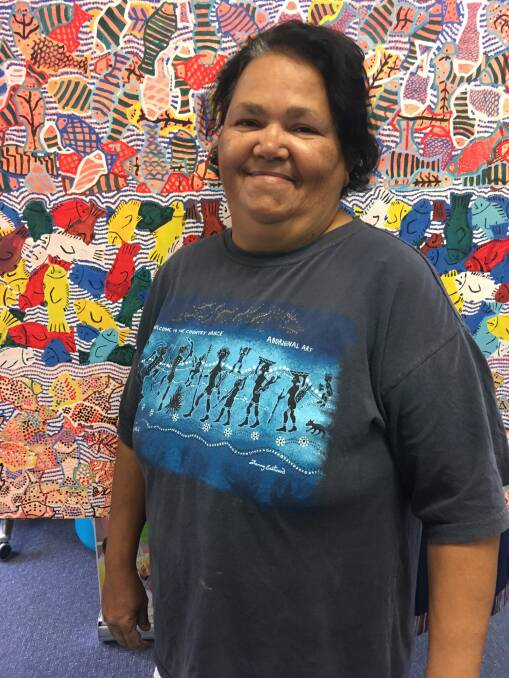 Angela Roberts, Biripai/Dunghutti artist and her artwork, Fish Dreaming, displayed at TAFE NSW Wauchope campus.
