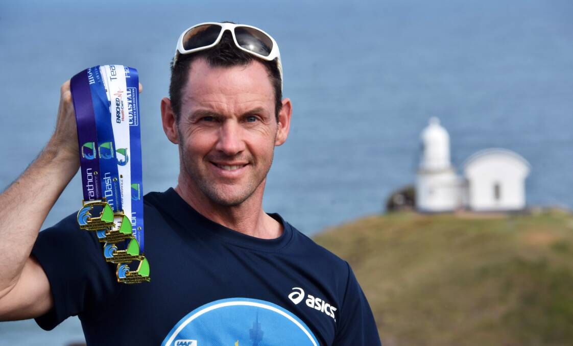 Up for grabs: Beach to Brother organiser Michael Maher with the medals the winners will receive on Sunday. Photo: Ivan Sajko.