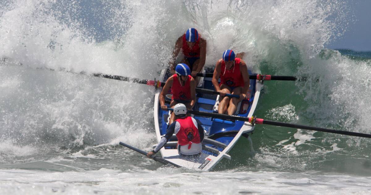 Tough test: Wauchope-Bonny Hills' men's open crew tackle the ocean at Minnie Waters. Photo: Sheenah Whitten