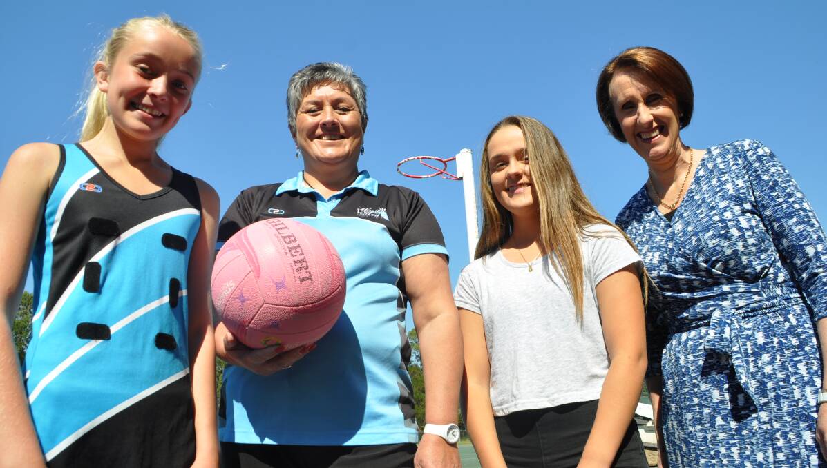 Big news: Ella Handley, Helen Miles, Petrea Spencer and Member for Port Macquarie Leslie Williams at the Macquarie Park netball courts. Photo: Peter Daniels