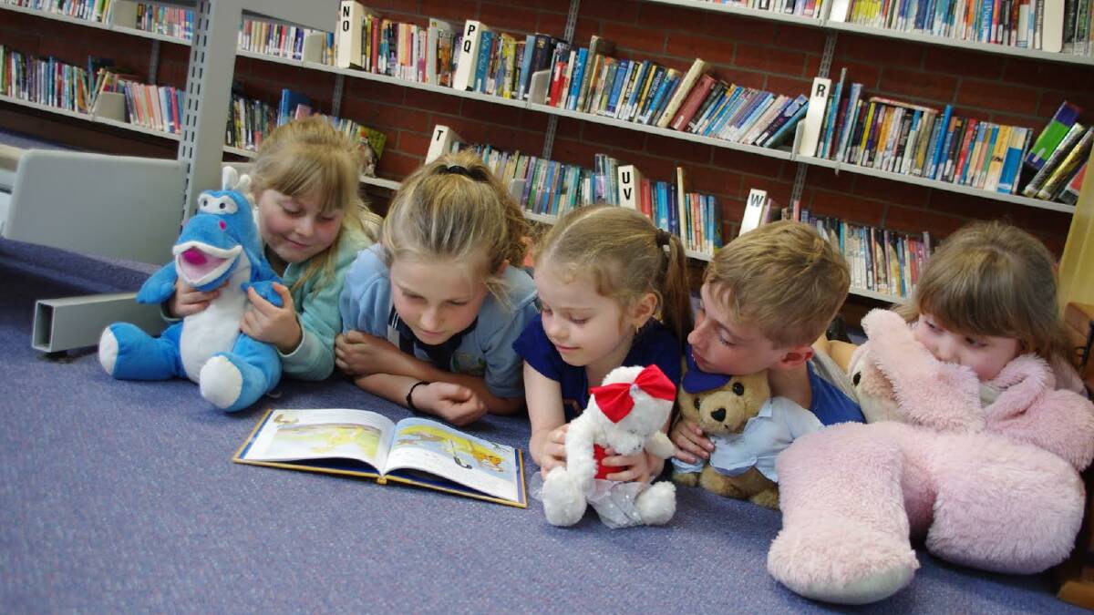 Story time: Jemma  from year five enjoying her time with the younger students.