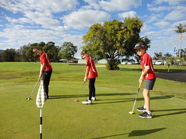 Practicing: Harrison Golledge, Breyella Golledge and Colby Wilkinson are part of the Red Swarm on the putting green.