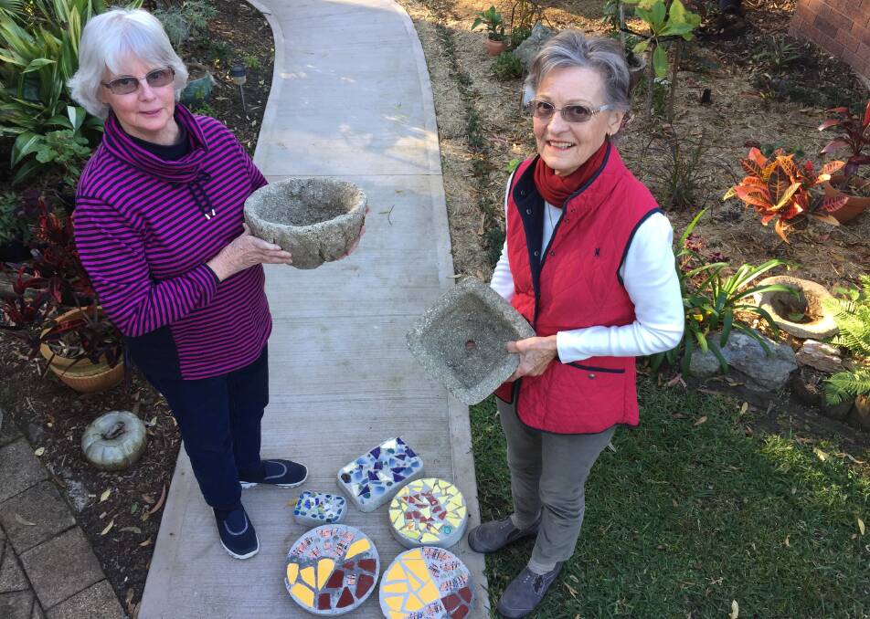 Passionate: The Tactile Arts Group at Kendall treasurer Karen Brown and member Barbara Crowe show off some of their finished creations including mosaic stepping stones and cement garden pots. 