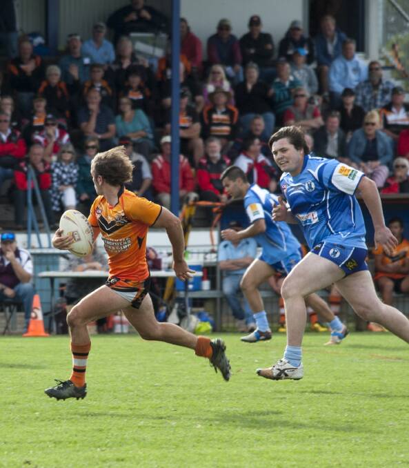 Mad dash: Dean Hurrell for Comboyne on the run from the Kendall Blues in the finals clash on the weekend.