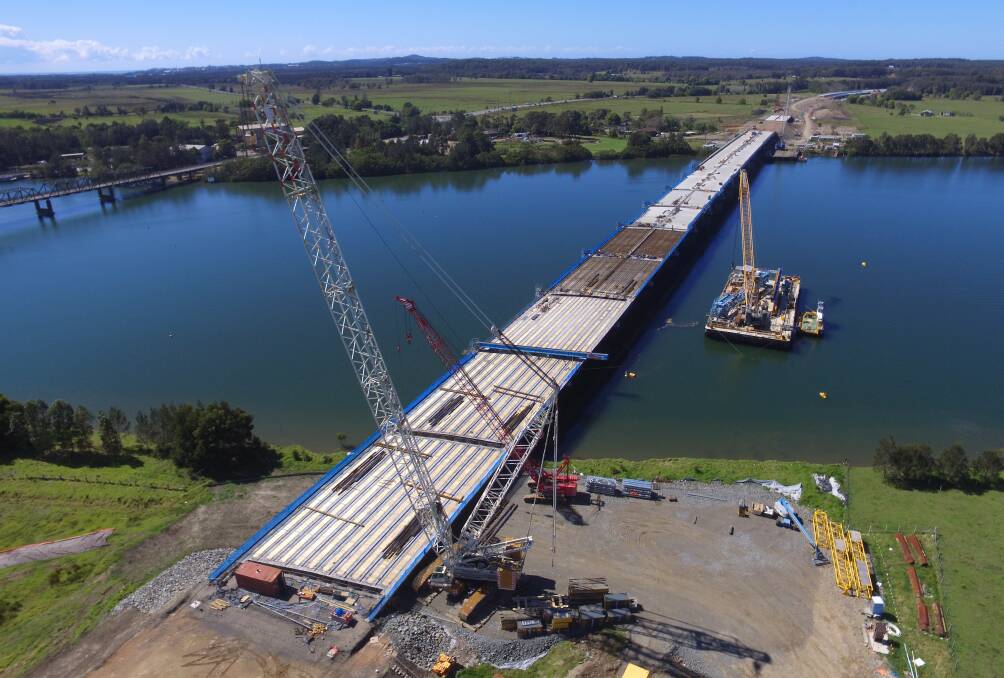 The final concrete girder for the new Hastings River Bridge being lifted into place.