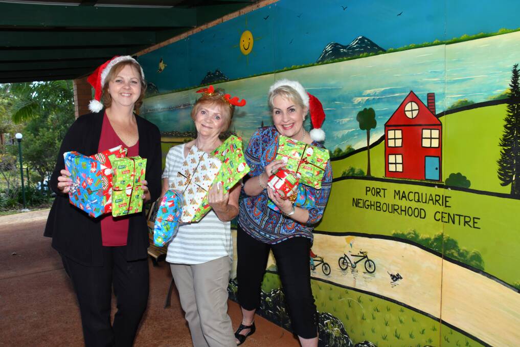 Spirit of generosity: Julie Trowbridge, Carol Kendall and Nuscha Van Nieuwkere from the Port Macquarie Neighbourhood Centre encourage people to donate Christmas presents to put a smile on children's faces.