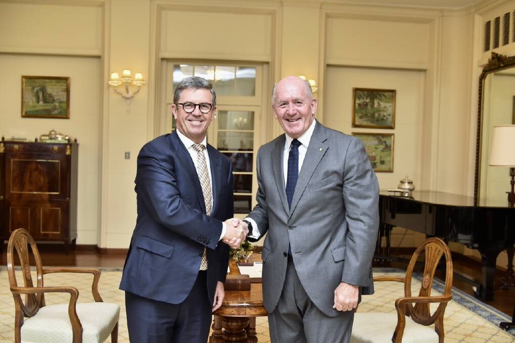 It's official: Governor-General Peter Cosgrove (right) congratulates Lyne MP Dr David Gillespie on his appointment as the Assistant Minister for Health. Photo: Auspic