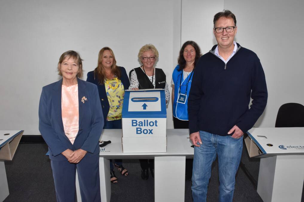 Official process: Mayoral candidates Lisa Intemann and Peta Pinson, returning officer Maureen Morris, senior office assistant Cathy Wright and mayoral candidate Robert Turner at the ballot paper draw.