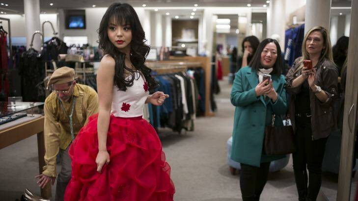 Anastasia Lin, the reigning Miss Canada, tries on her Miss World pageant dress in Toronto. Photo: New York Times
