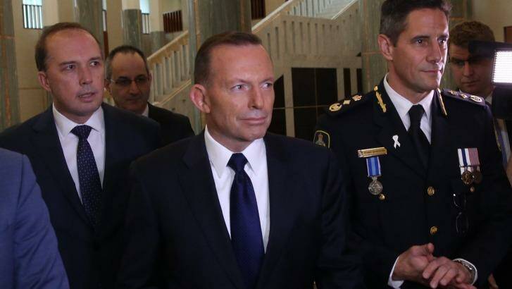 Immigration Minister Peter Dutton, Prime Minister Tony Abbott and Australian Border Force commissioner Roman Quaedvlieg. Photo: Andrew Meares