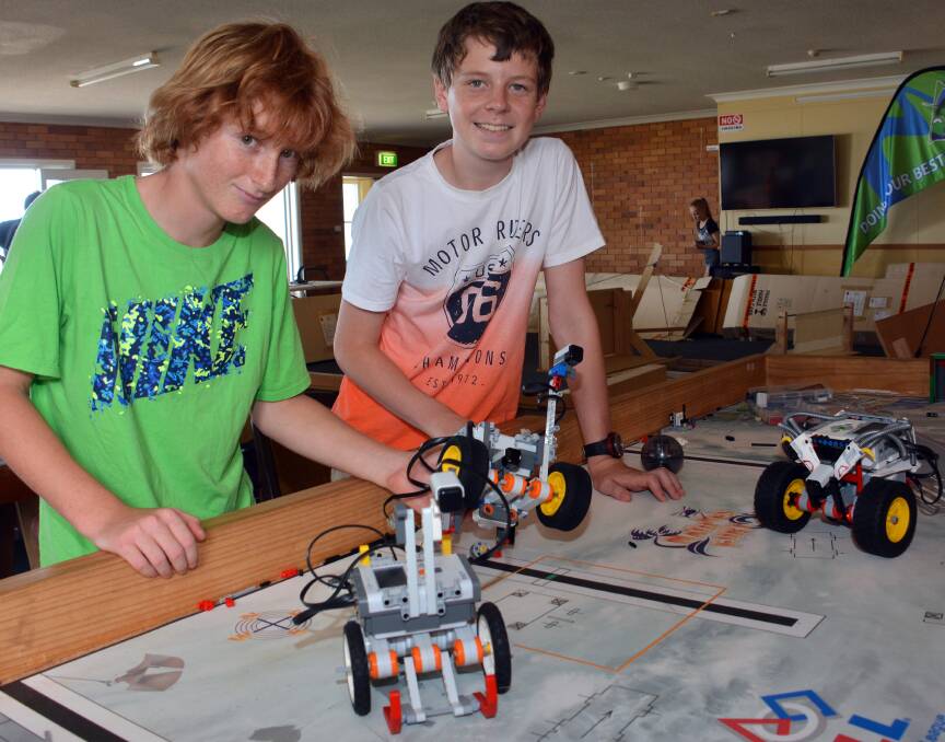 Goal: Year 7 students Daniel Ferguson and Ben White work on their soccer bot at the Camden Haven High School Robotics Expo.