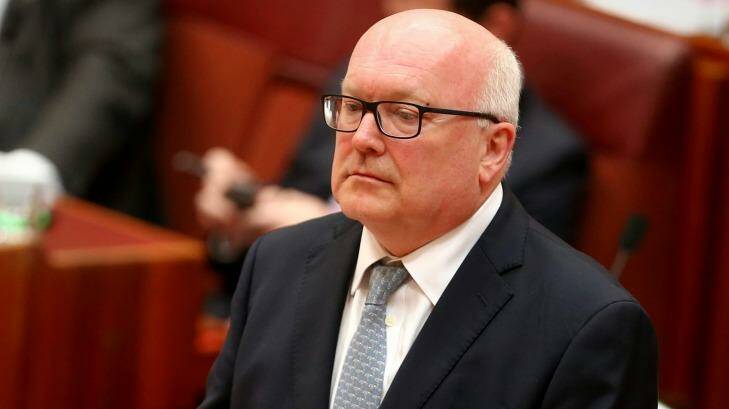 Attorney-General George Brandis has argued that people should be able to get a court to stop a story being published if they thought it might defame them. Photo: Alex Ellinghausen