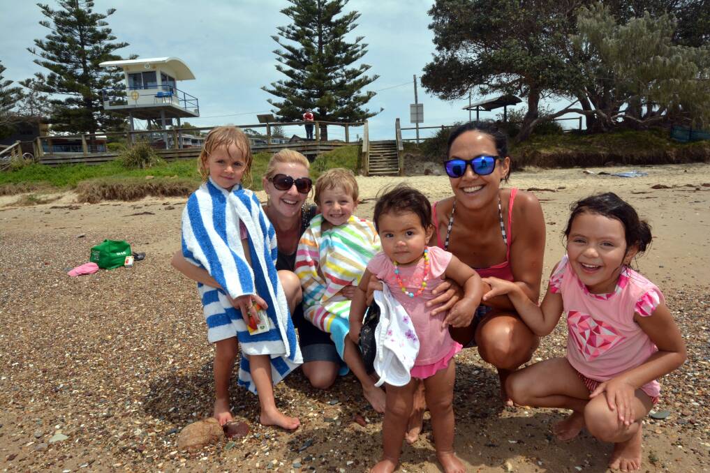 Happy on the beach: Rubi-May Lo-Monaco, Chantell Lo-Monaco, Jack Lo-Monaco, Tali Wood, Emma Wood and Latai Wood play on Rainbow Beach.