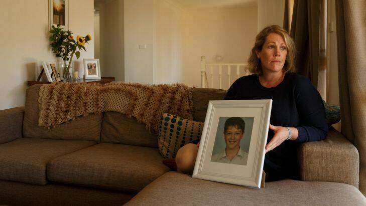 Michelle Degenhardt of Soldiers Point is pushing for a coronial inquest into the death of her son Luca Raso, 13. Luca died of peritonitis as a result of appendicitis which his GP failed to identify. Pic shows Michelle holding a recent school portrait of Luca in her living room. Picture: Max Mason-Hubers MMH