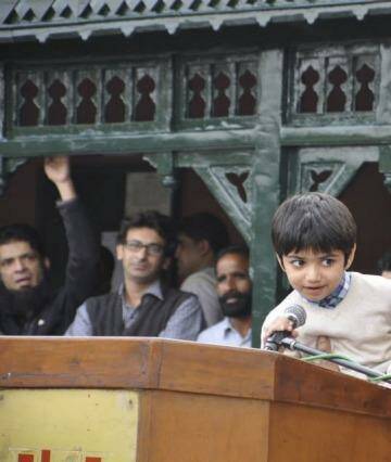 Sammy speaks: Sammy Sumbal, aged 8, son of Fayyaz Sumbal, a Pakistani police officer killed in a suicide bombing in 2013, thanks the crowd after the charity cricket game.  Photo: Supplied