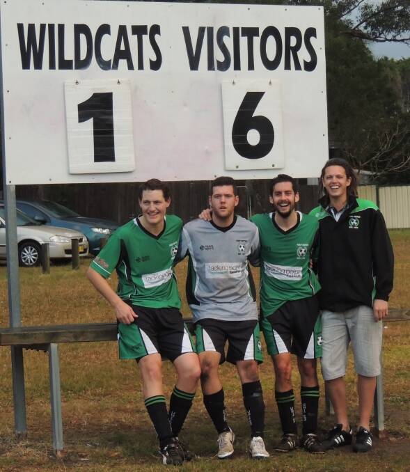 Big win: Daniel McGovern, Luke Jennings, Dave Straiton and Brett Ervine pose in front of the scoreboard after the match against Taree Wildcats on Saturday.