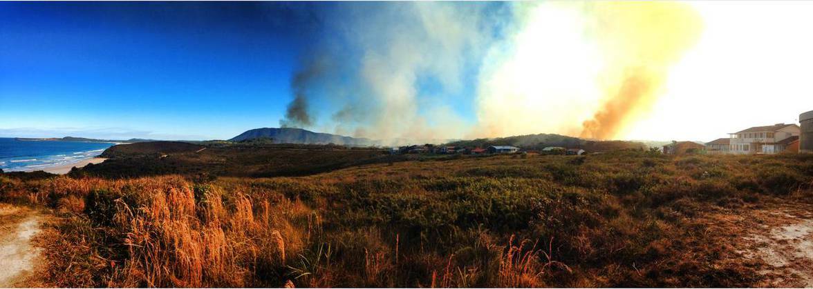 More smoke expected: Rain has slowed the fire burning south of Bonny Hilss. Pic: KANE DAEZAS GIMBERTO.