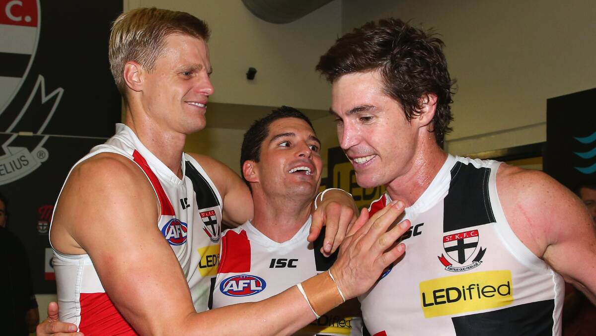 Nick Riewoldt, Leigh Montagna and Lenny Hayes of the Saints celebrate in the rooms after winning the round five AFL match between the Essendon Bombers and the St Kilda Saints at Etihad Stadium on April 19, 2014 in Melbourne, Australia. Photo: Quinn Rooney/Getty Images.