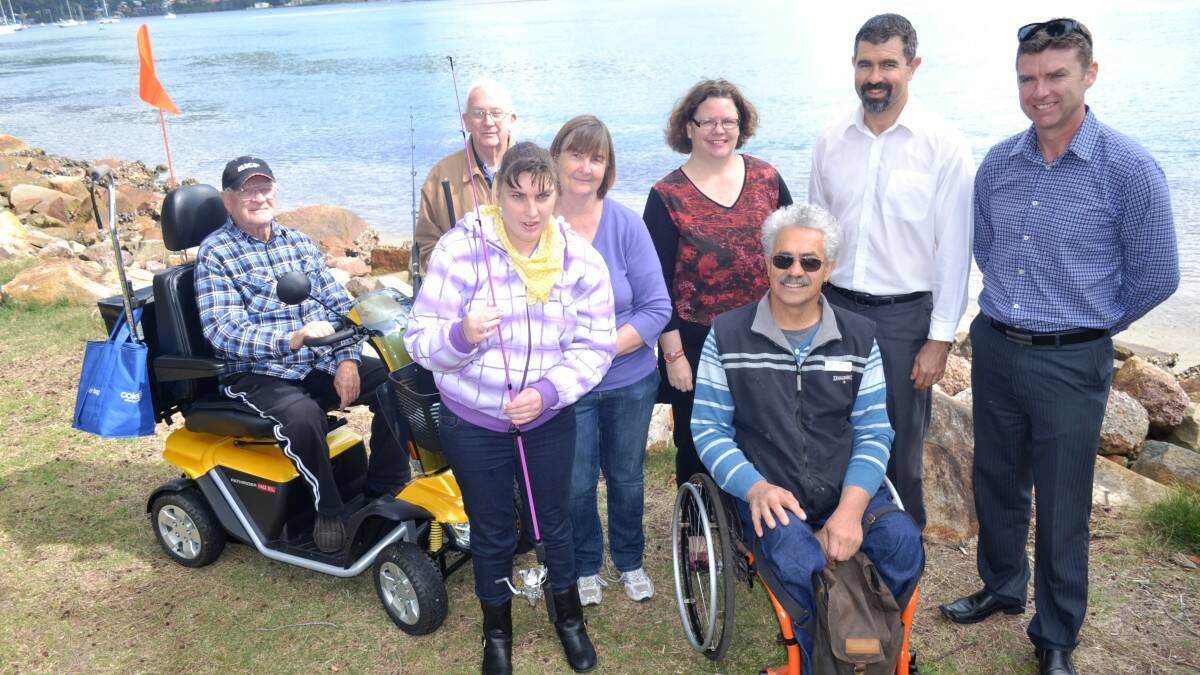 Fishing for all will be easy at the site of the region's first, purpose-built accessible fishing platform. Pictured from left are Jerry Janik, Max Waters, Samantha Rolfe, Ann MacDonald, Julie Priest, Mike Ipsen, Gary Randall and Peter Jenkins.