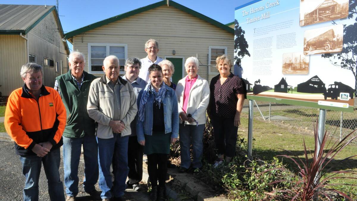 The first of many: The team responsible for the installation of signs telling the many colourful stories of Herons Creek - Brendon Guest (HSE advisor, Boral) with committee members Bill Boyd, Les Latham, Scott Hastings, Martin Parish, Sam Clark, Betty Boyd, Daphne Latham and Margaret Lamb.