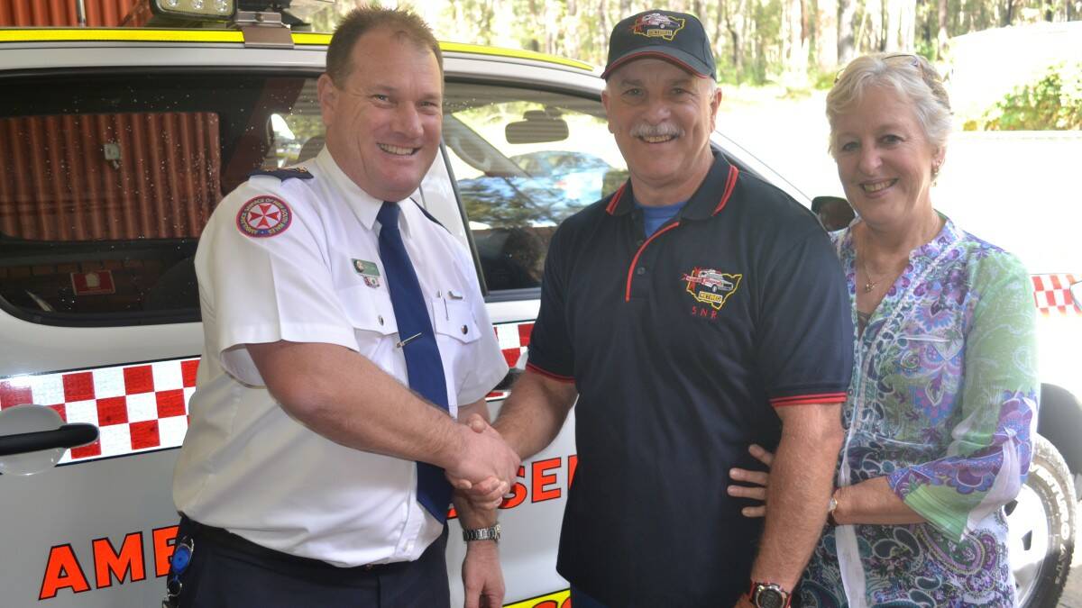 Farewell: Barb and Ian Spencer with Ambulance Service Superintendent Evan Clarke.