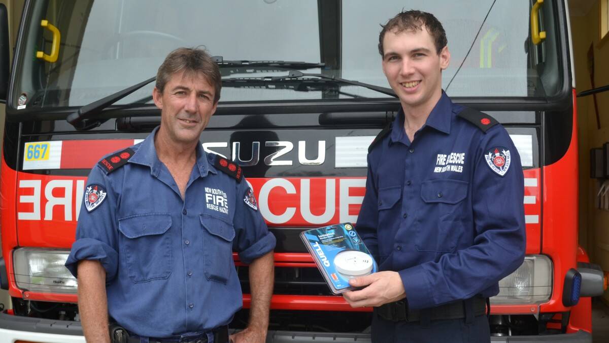 Safety first: Laurieton Fire & Rescue Brigade's new captain, Les King, left, and new deputy captain Jason Clark, are encouraging people to change the battery in their smoke alarms when they change their clocks on April 6.