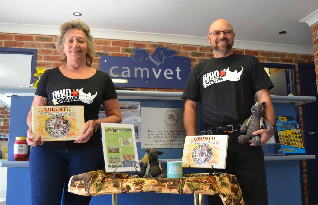 SUPPORTING RHINO CAUSE: Corinne Broadby and Gavin Rippon with some of the prizes to be won in the colouring competition and raffle.