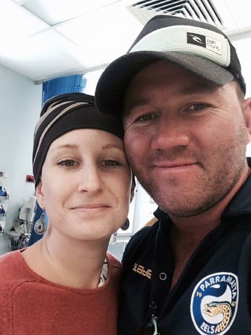 TEAMWORK: Jess and Dale Higgins at Jess' final round of chemotherapy in Port Macquarie.