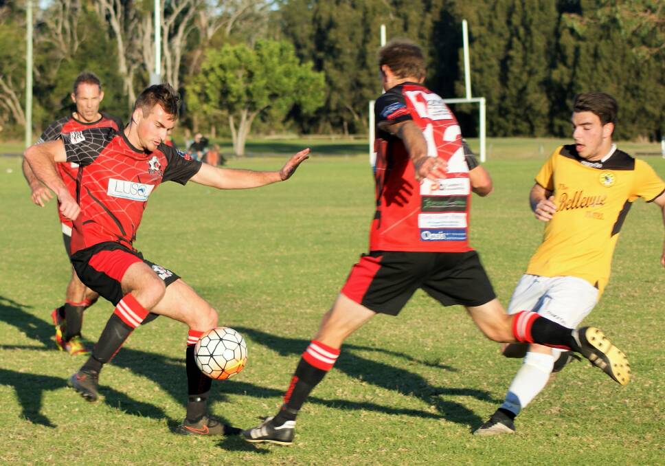 TOUGH: Nick Cummins contesting for the ball in the previous game against Tuncurry. PHOTO: Luisa Papas