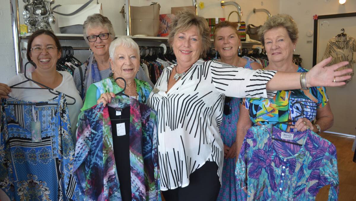 BACK IN FASHION: Wendy Dunn, centre, with a few of her loyal customers who were there on Friday when the doors reopened. Pictured checking out the new stock were Elizabeth Cunningham, Wilma Henriksen, Gwen Bunting and Genie Davies.