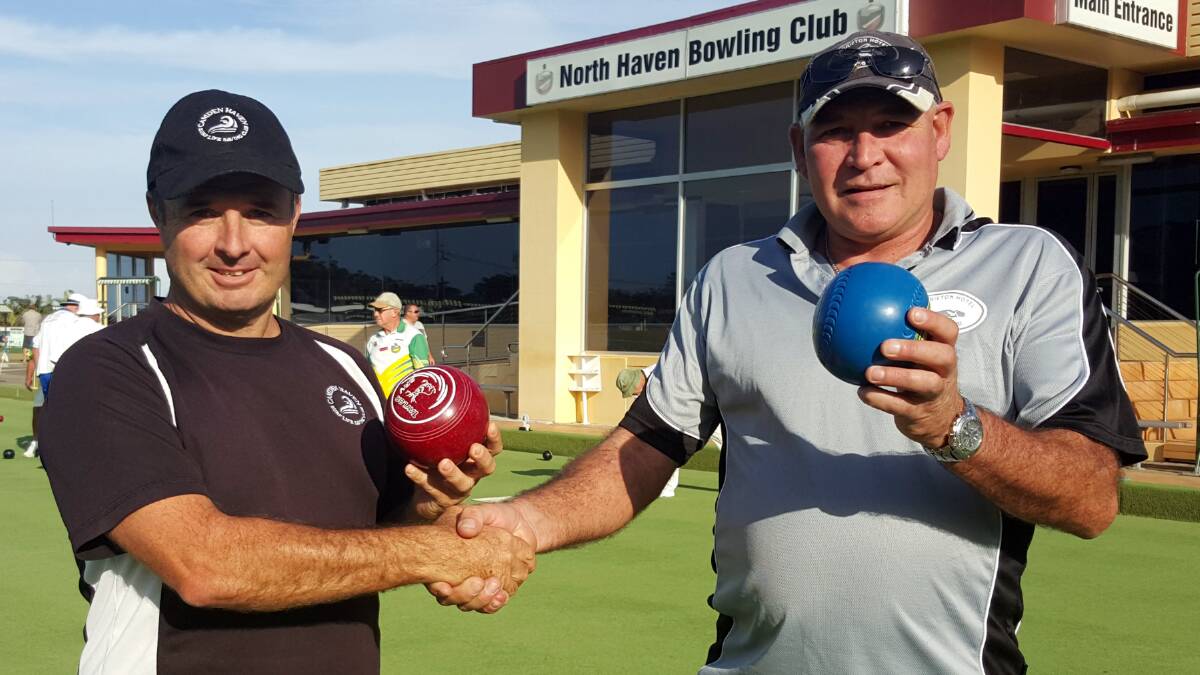 Ready for battle: Camden Haven Surf Club president Glen O'Brien and Laurieton Hotel Fishing Club president Pete Jackson compare their bowls in preparation for the Battle of the Seas on the Greens charity day.