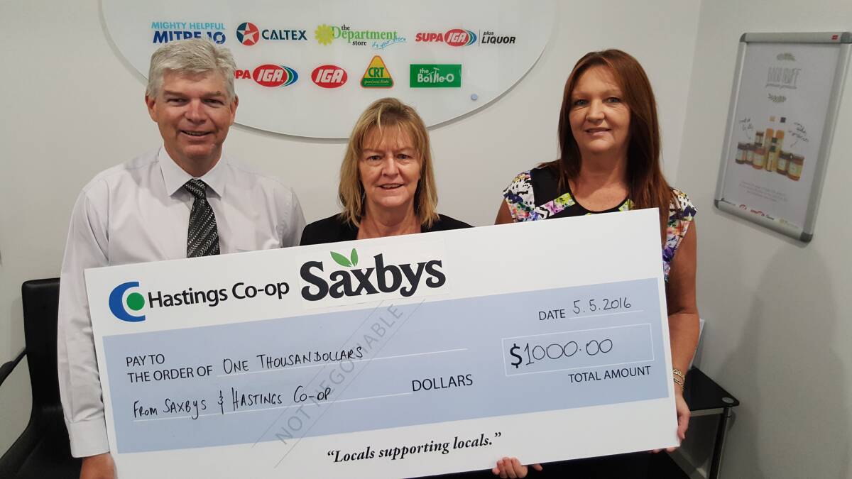 Hastings Co-op chief executive officer Allan Gordon and local Saxby’s representative Lee Coombes (right) present a $1000 cheque to Hastings Education Fund secretary Joy Corben.