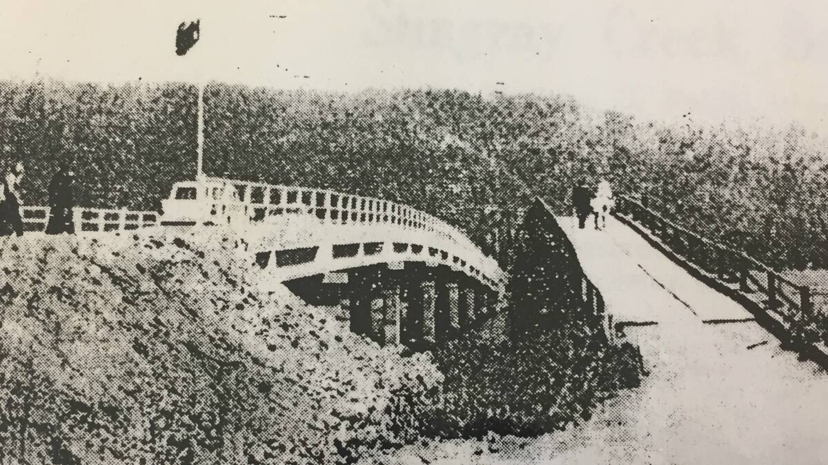 From the Camden Haven Courier, November 10, 1961: The new concrete, two-lane bridge officially opened on Saturday last, will replace the old "humpty-back" wooden structure. Here the two bridges are seen with North Brother Mountain (named by Captain James Cook) forming a background. Final cost of the new bridge is expected to be in the vicinity of 60,000 pounds.