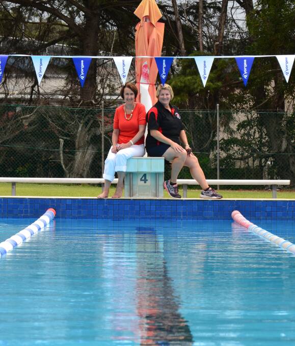 ON THE BLOCKS: MP Leslie Williams with Laurieton Swimming Club vice president Michelle Kirkwood atop one of the starting blocks to be replaced at the Laurieton pool. PHOTO: Kate Dwyer