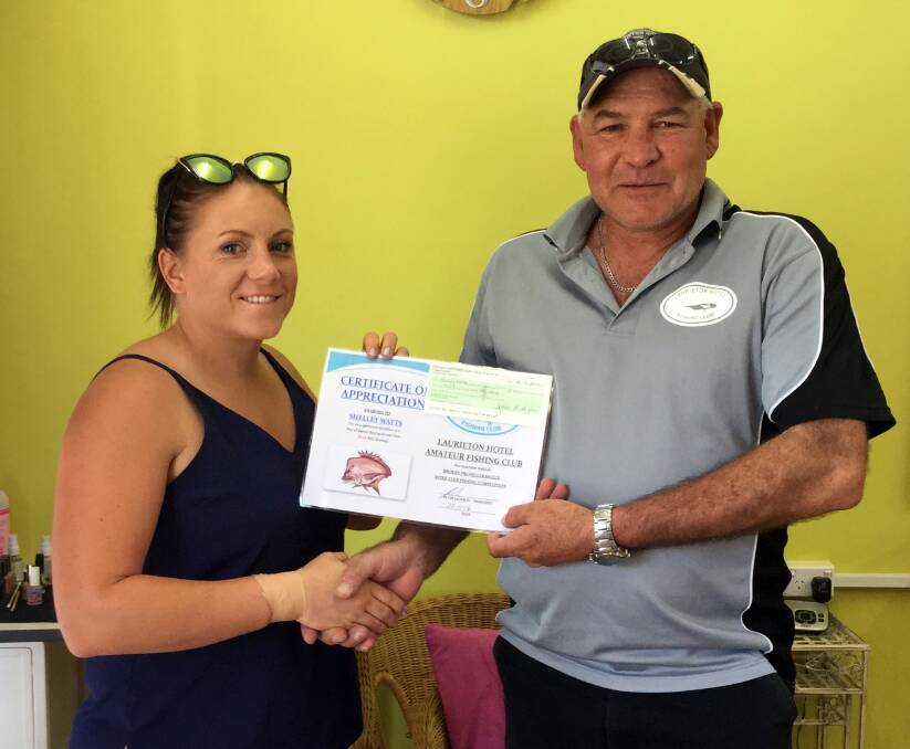 WITH APPRECIATION: Shelley Watts presented a certificate to Peter Jackson from the Laurieton Hotel Fishing Club.