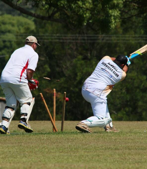 REARRANGING THE TIMBERWARE:  Jarryd Gaskin being bowled by Izach Dennis.  Lindsey Dennis wicket  keeper. PHOTO: Pat Kerr