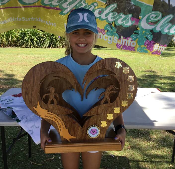 Rookie of the Year: Emily Cougle with the perpetual trophy for Mid North Coast Surfriders.