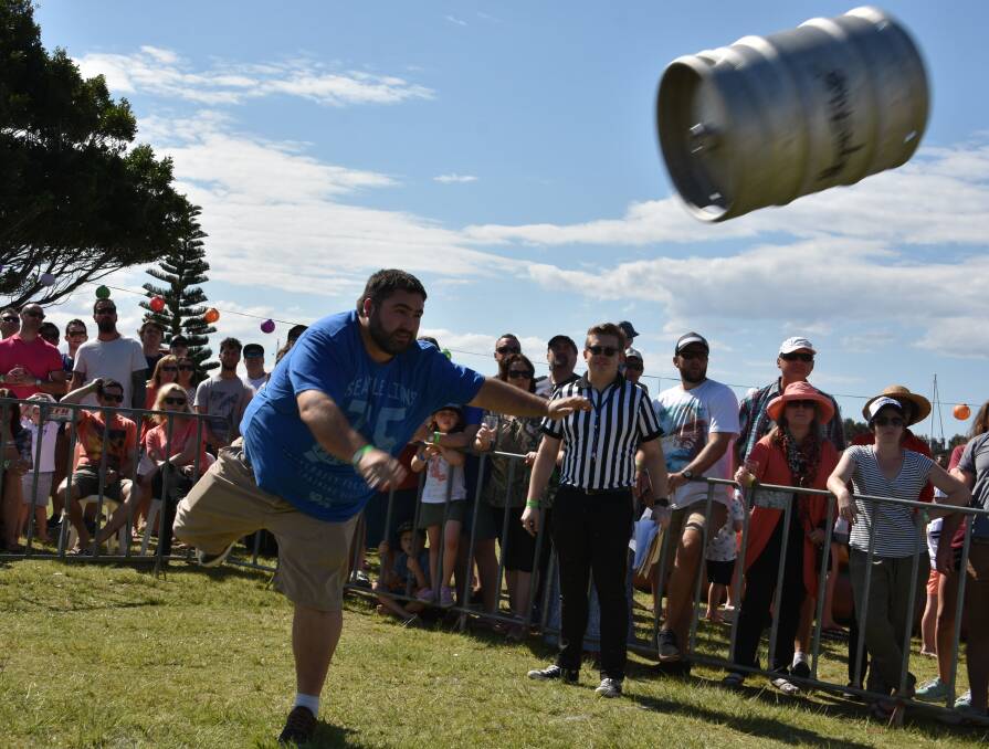 Big throw: David Bosco participating in the keg toss in 2016. The event returns, along with some new ones, this weekend.