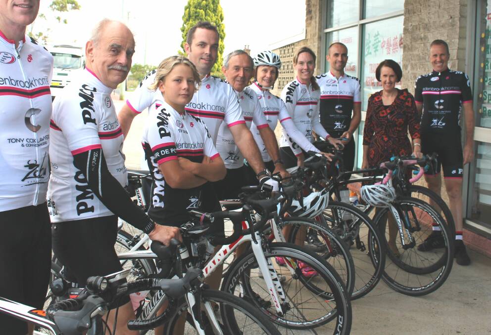 Leslie Williams and local cyclists who will benefit from the funding.
