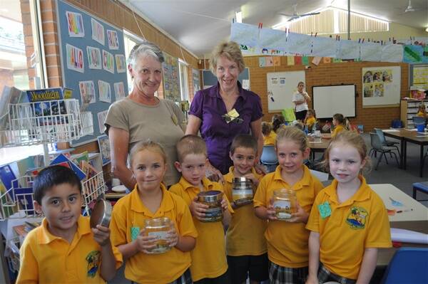 Laurieton United Services Club Garden Club president Judy Wills and treasurer Leona Marshall helped out year one students at St Joseph’s Primary last Wednesday afternoon with their science studies.