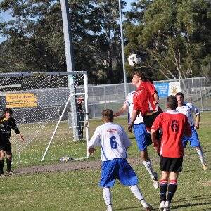 Will Bennett directs a header goalwards for the Redbacks on Saturday