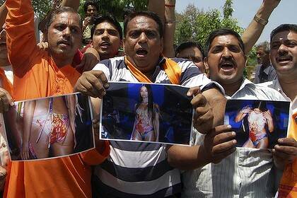 Indian activists of the right-wing Hindu organisation Shiv Sena hold photocopies of models wearing swimwear featuring Hindu goddess Lakshmi during a demonstration in Amritsar on Sunday.