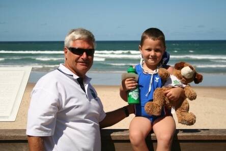Helping hand: Gary Taylor (GT) Mal de Mer’s Club Representative and young Xander Bogg WBH Nippers.