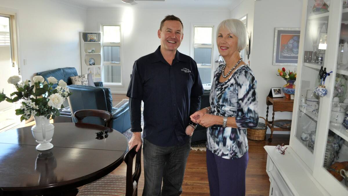 Ocean Club Resort's John Gilmour with new resident Anna Wilson in her new home.