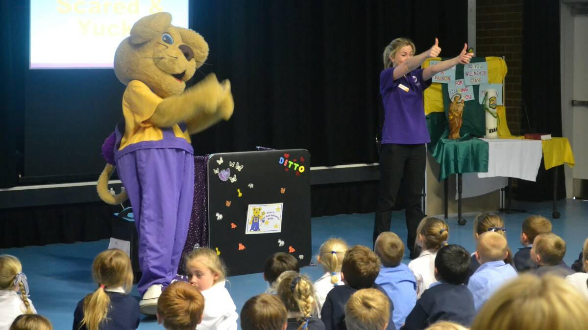 Ditto the Bravehearts Lion and friend educate local kids on the importance of personal safety.